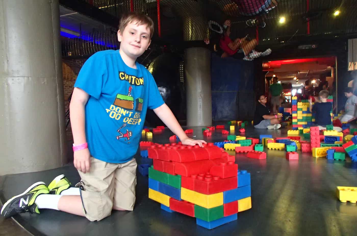 kid playing with giant LEGOs at the City Museum