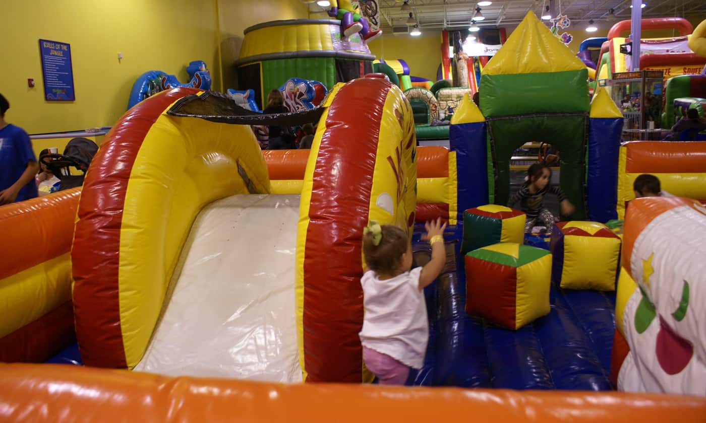 kids playing on inflatables at Monkey Joes indoor play 