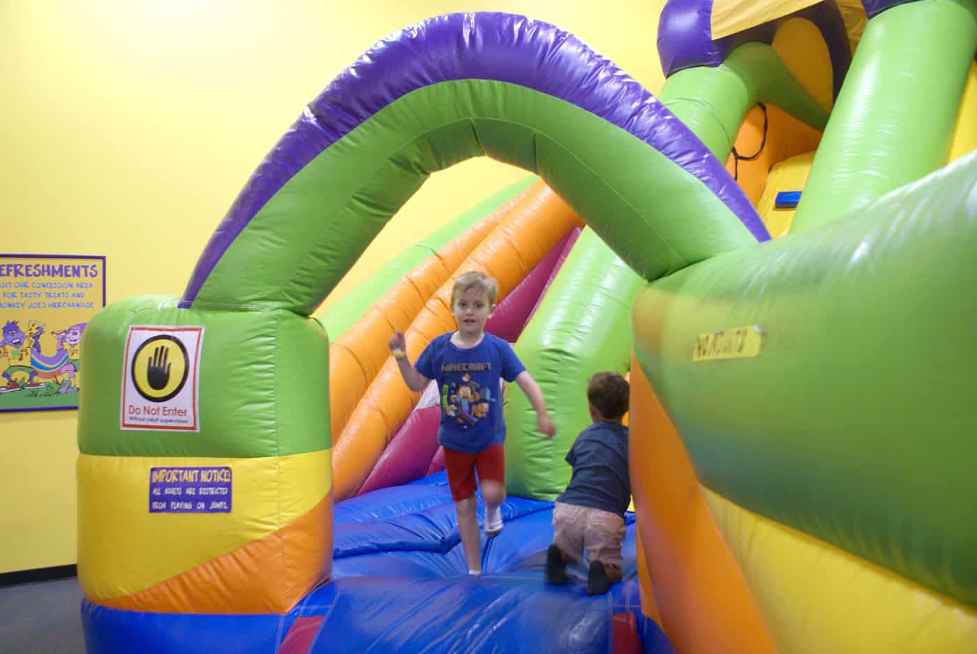 Kid on inflatable at Monkey Joes