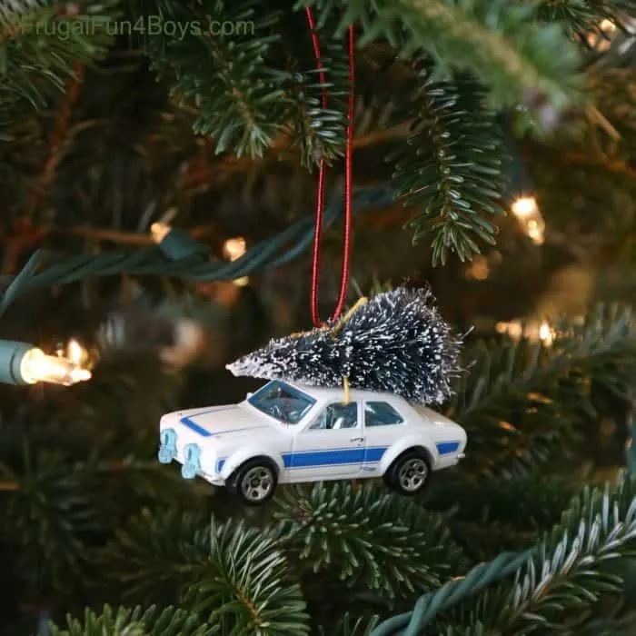 bringing home the Christmas tree ornament with a Hot Wheel