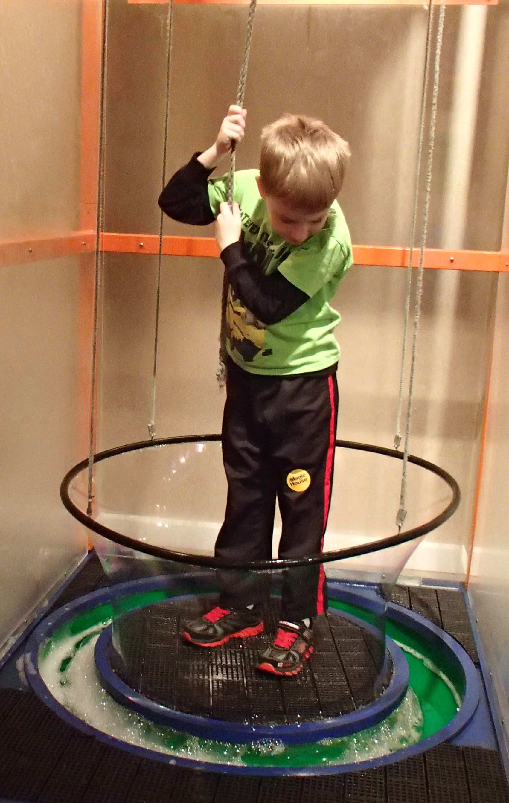 kid in giant bubble machine at the Magic House