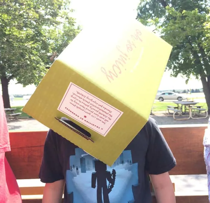 Boy wears an Eckert's Farm box on his head 