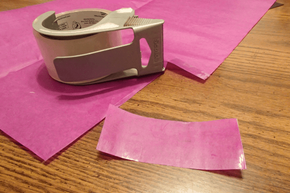 purple paper is waterproofed with packing tape