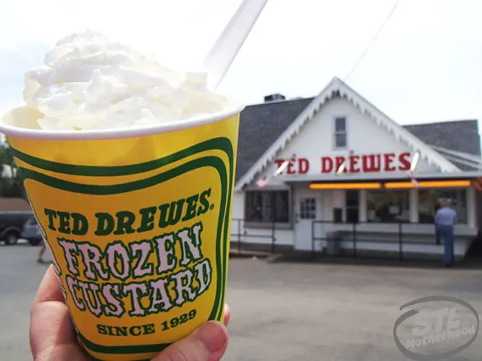 Ted Drewes frozen custard in a yellow cup, building in the background