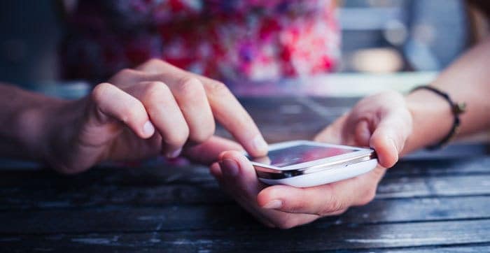 female hands using a smart phone