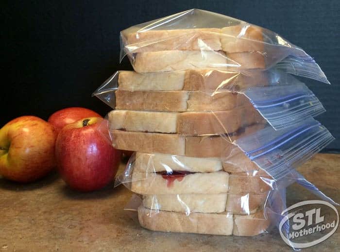 peanut butter and jelly sandwiches, stacked and frozen.