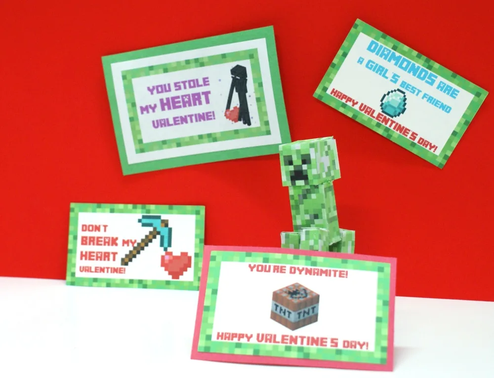 Paper Minecraft creeper sitting near Valentine cards