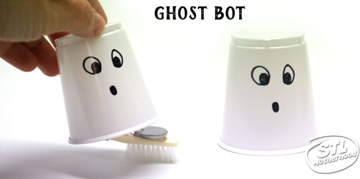 Halloween ghost bot --brush bot inside a white plastic cup with a ghost face drawn on