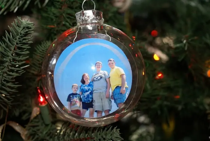 plastic ornament with family photo floating inside