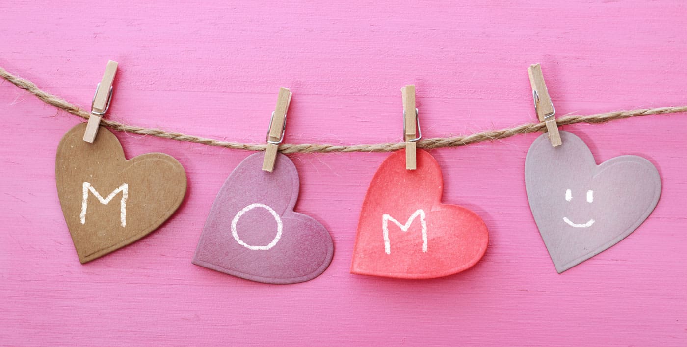 paper hearts on a string, spells out mom