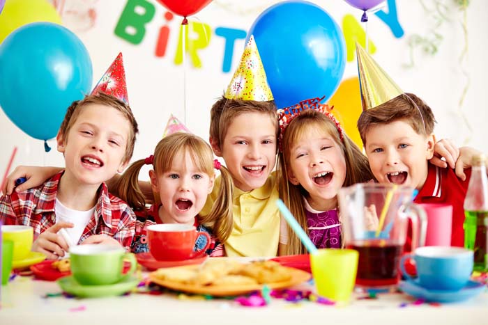 Group of adorable kids having fun at birthday party