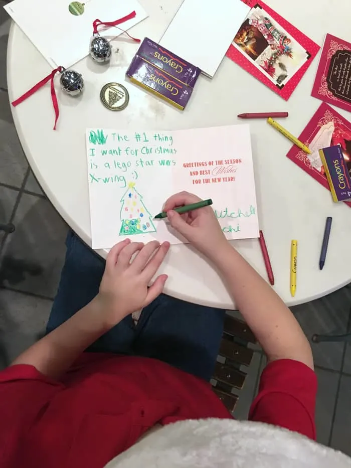 over head photo of kid writing a santa letter