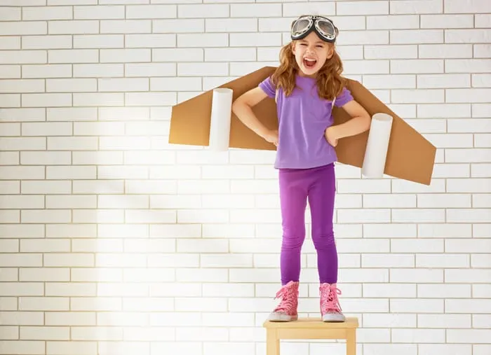 child is dressed in an astronaut costume