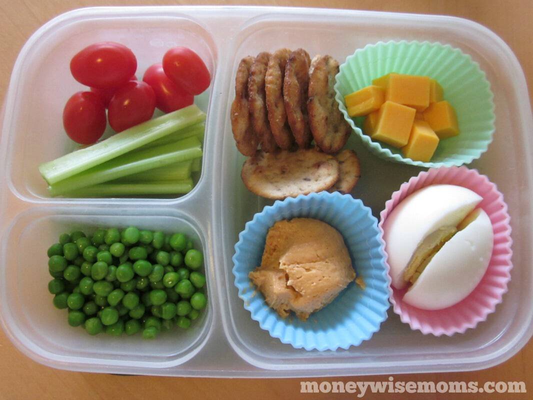 disposable food container with silicone cups holding portions of lunch, bento style 