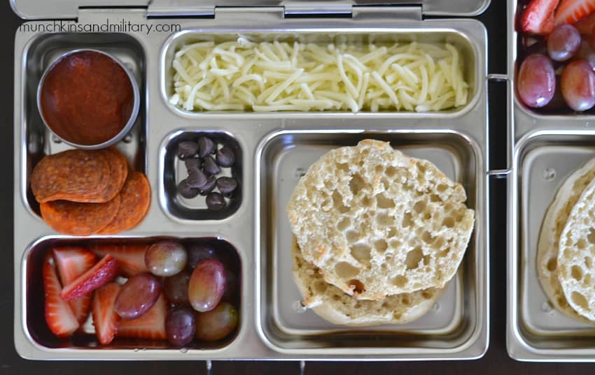 Metal bento box with lunch: ingredients for a pizza