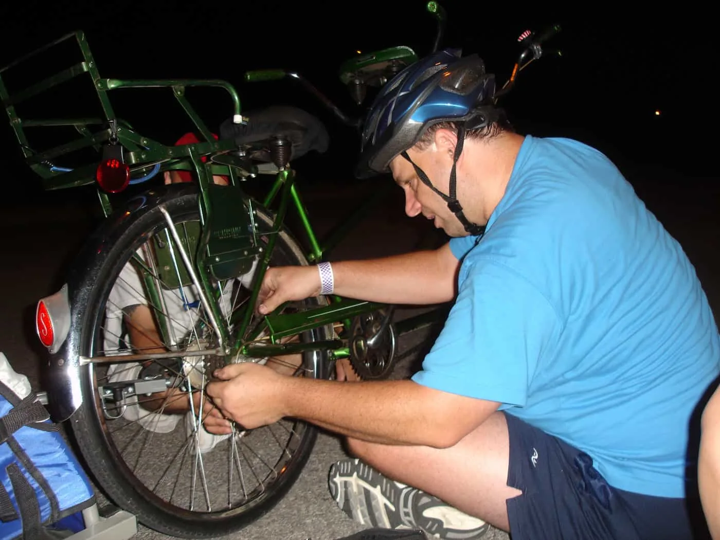 Man fixing tandem bike