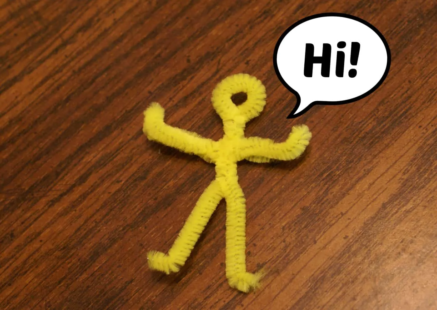 parachute guy made from yellow fuzzy stick