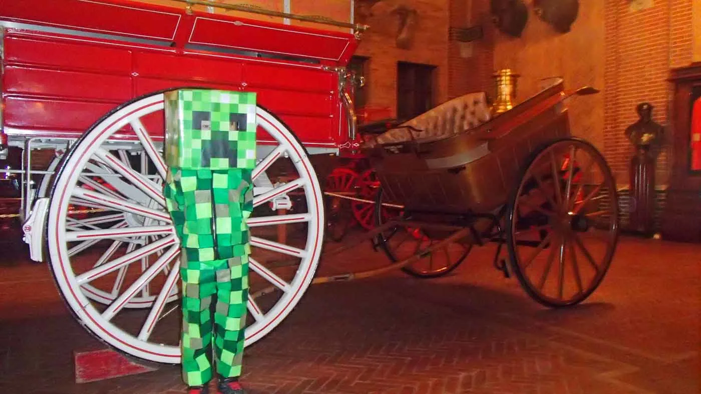 kid in halloween minecraft creeper costume