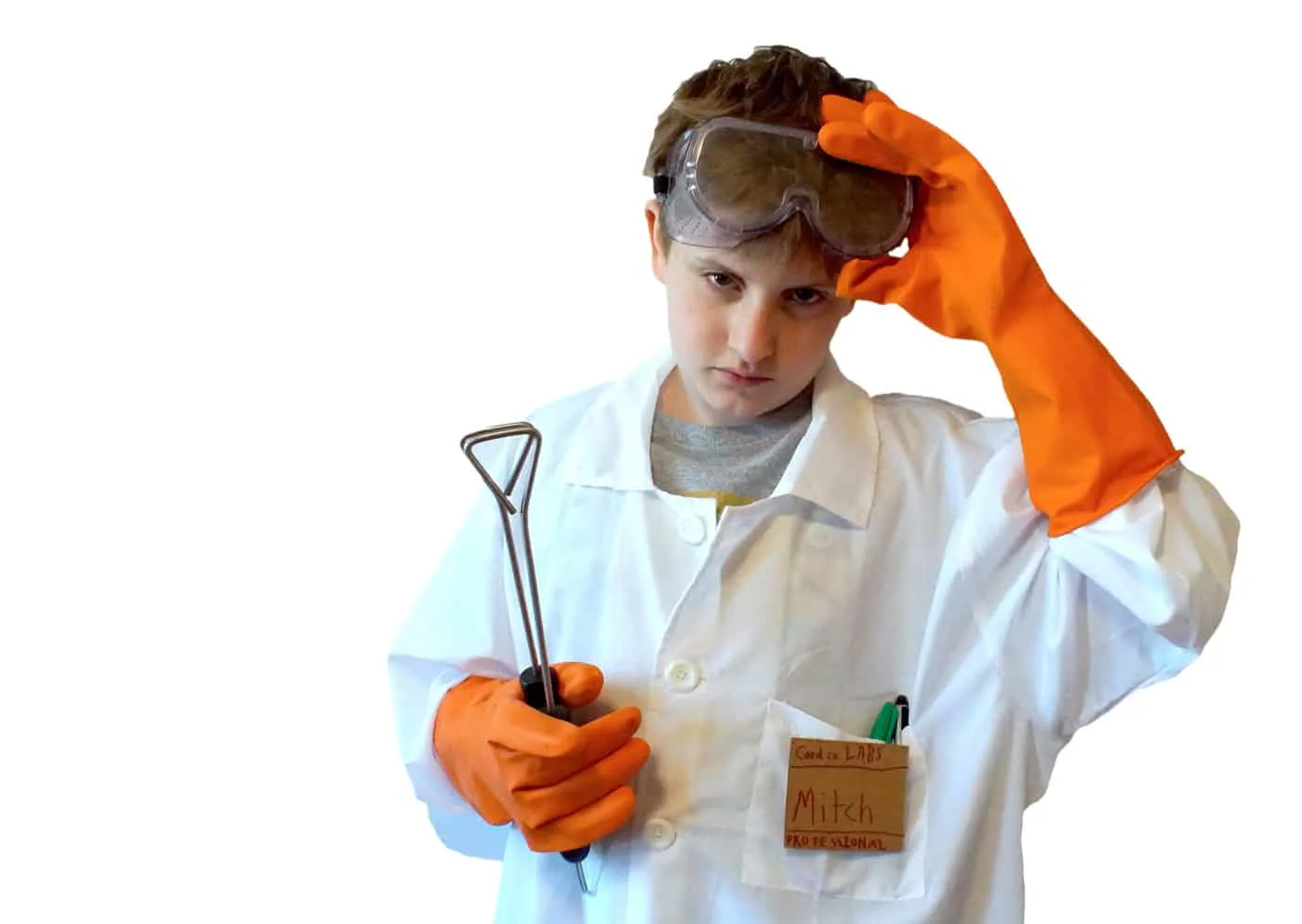 kid dressed as scientist in lab coat, goggles and rubber gloves