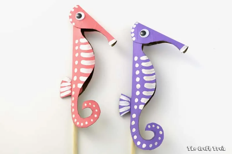 cardboard seahorses in pink and purple