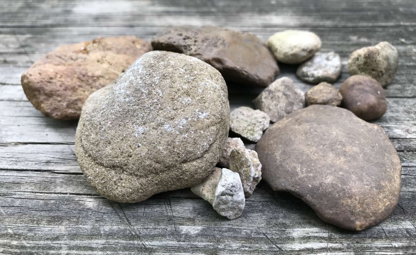 plain rocks on a wooden picnic table