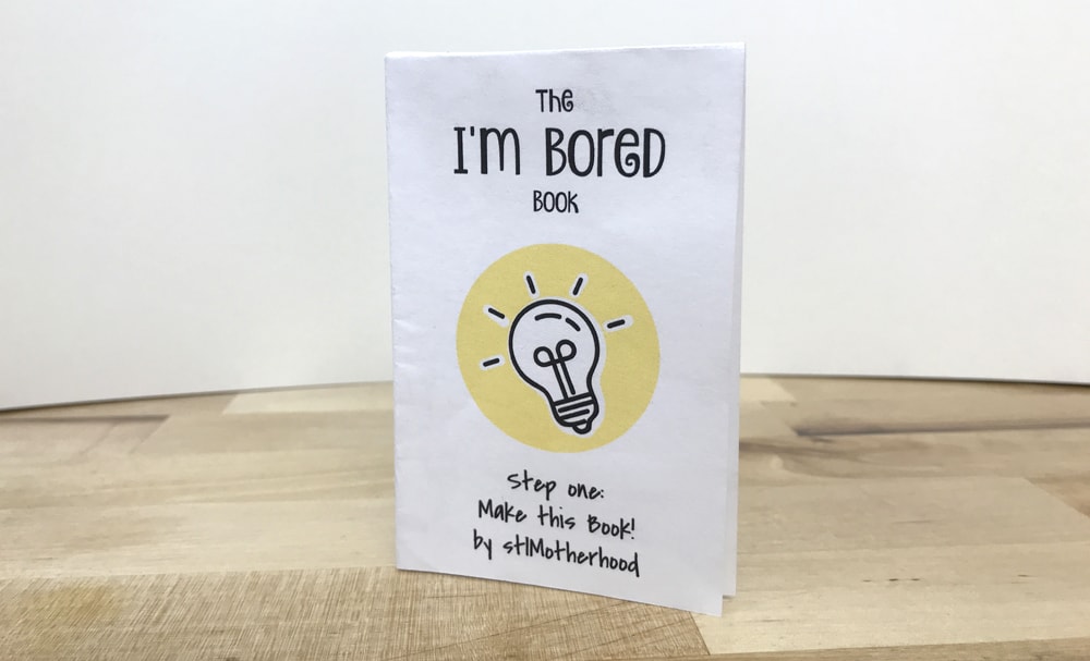 handmade paper book titled I'm Bored with a light bulb graphic