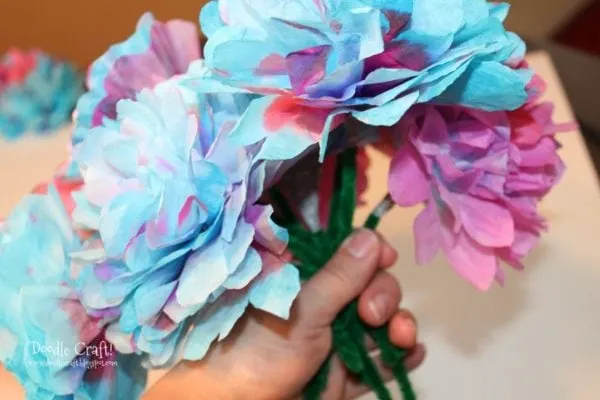 bundle of flowers made from blue and purple coffee filters