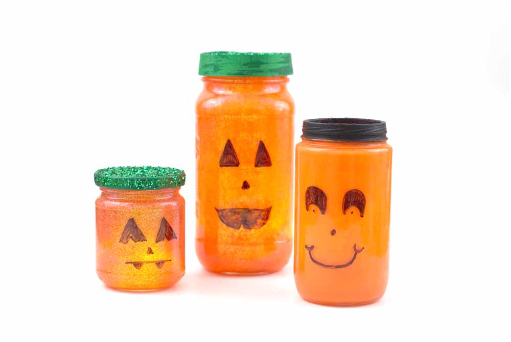 recycled jars painted like pumpkins