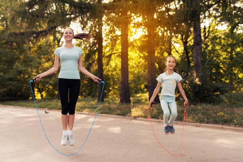 mother and daughter jump rope together