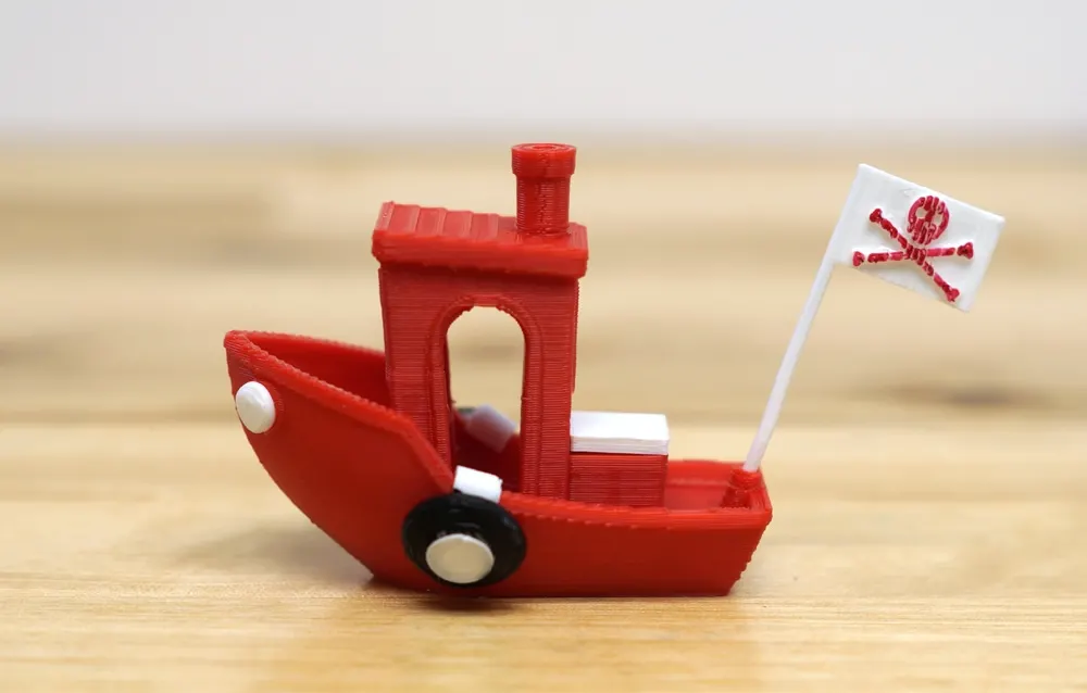 a Red Benchy decked out with a pirate flag and bumpers.