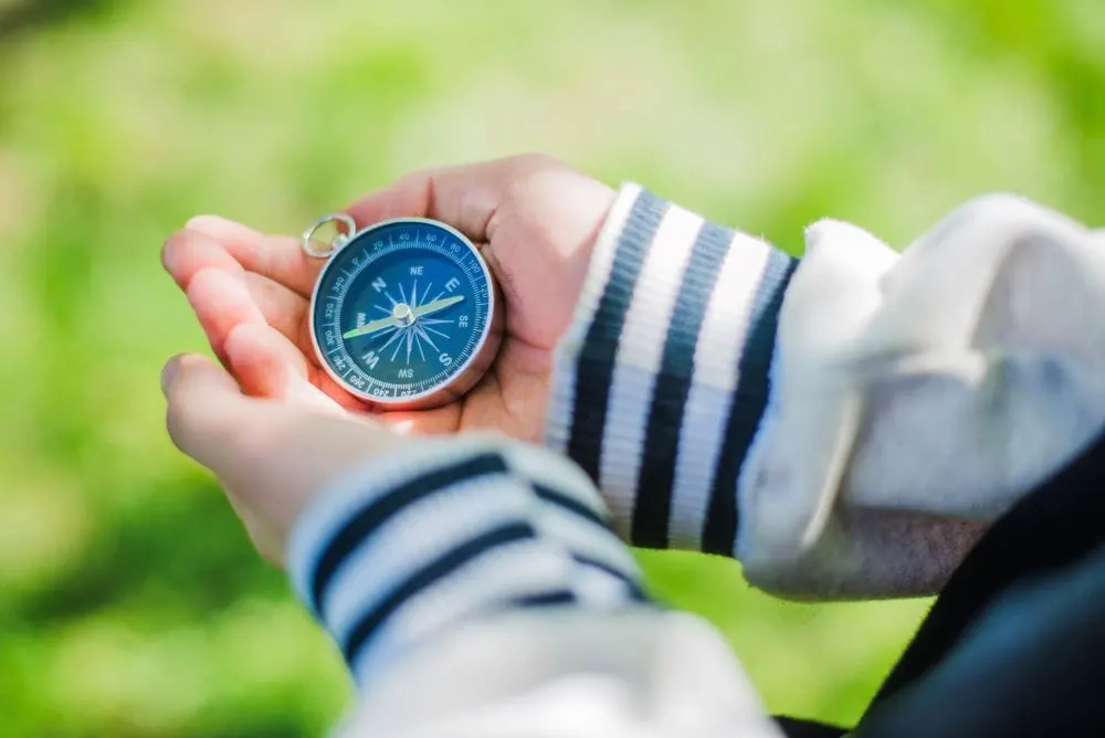 compass in boys hand