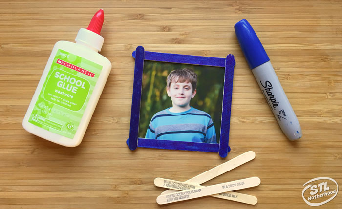 Basic supplies you need to make a popsicle stick frame: craft sticks, markers and glue