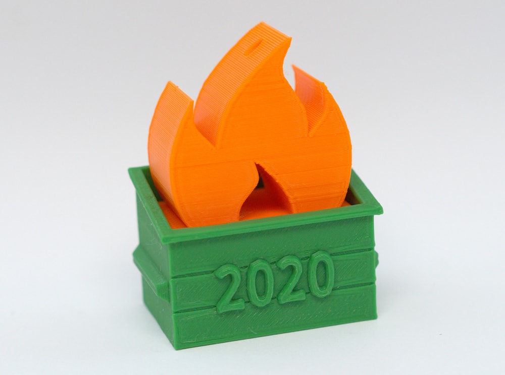 3D printed dumpster fire in orange and green