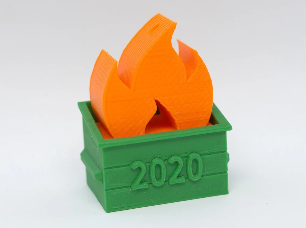 3D printed dumpster fire in orange and green