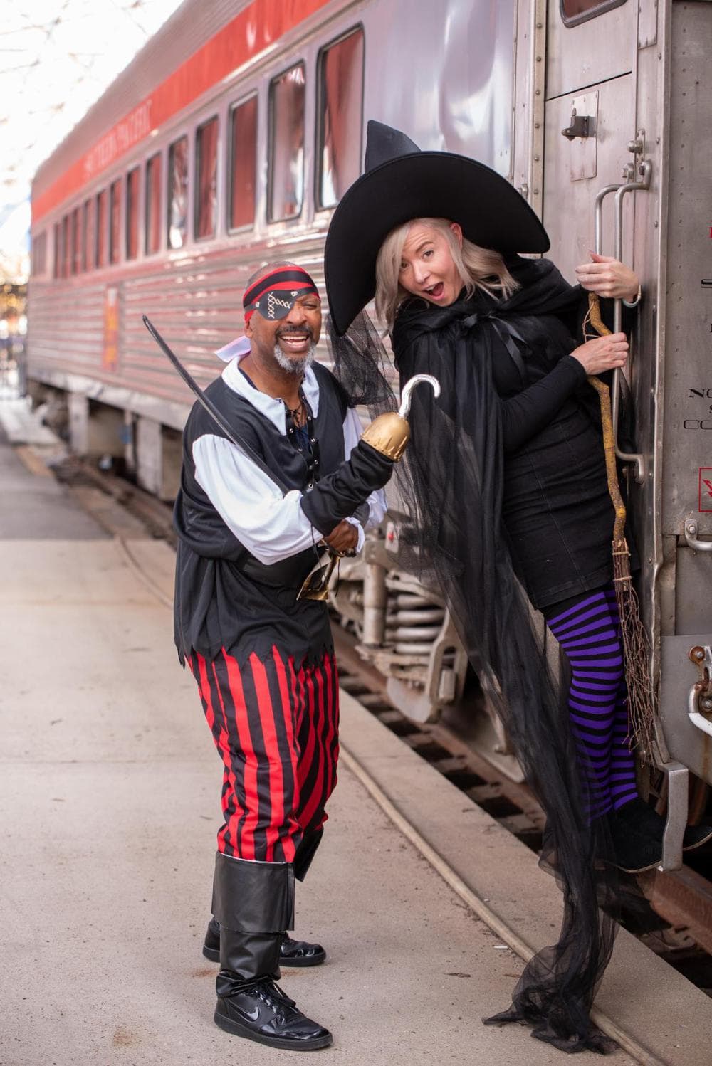 A pirate and witch ready to greet kids at Union Station for Halloween