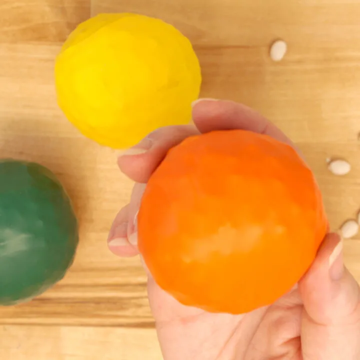 bean balls made of balloons in orange, yellow and green