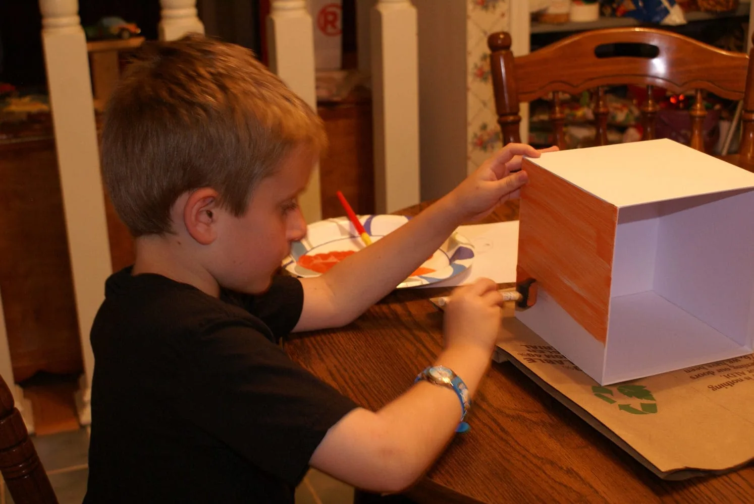 kid painting minecraft paper pumpkin