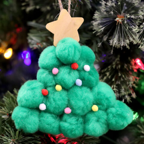 Christmas tree made of pom poms with star on top