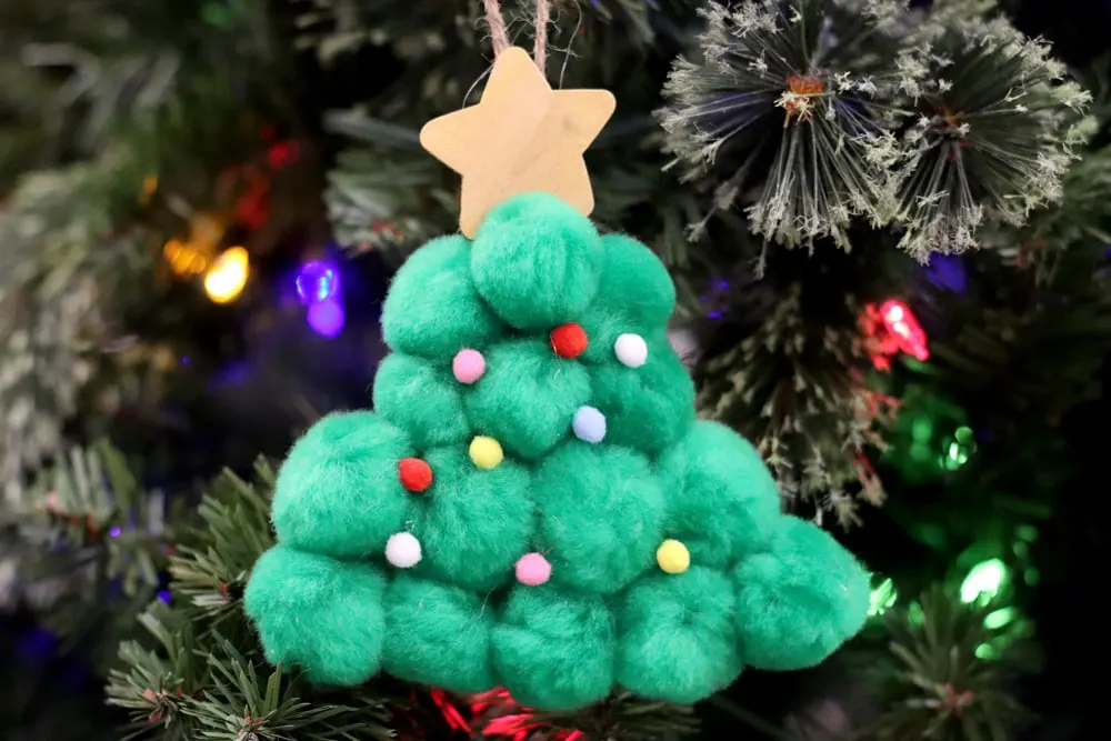 Christmas tree made of pom poms with star on top