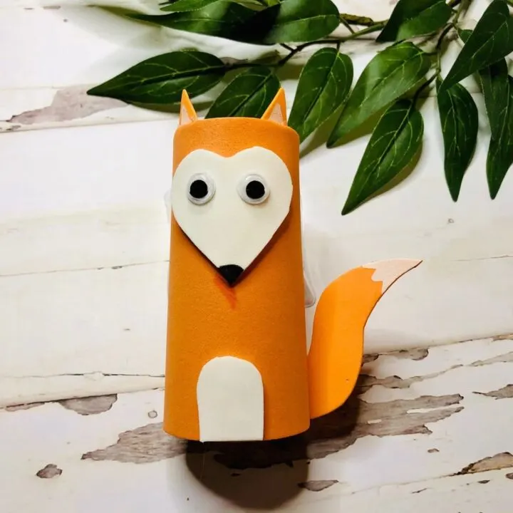 paper fox crafted from orange cardstock and a toilet paper roll