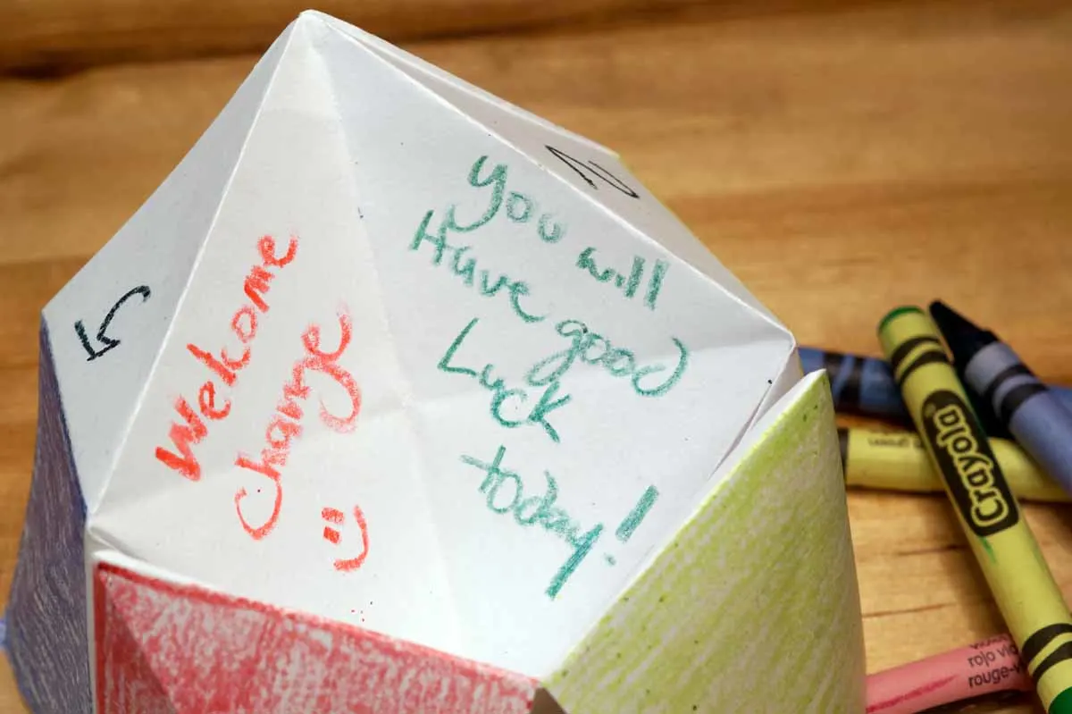 Inside a fortune teller, written in crayon: Welcome Change! and You will have Good Luck today!