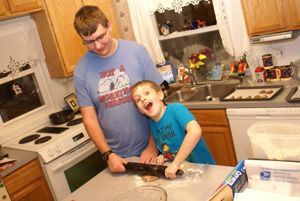 two brothers baking cookies