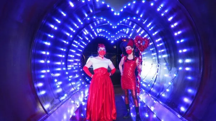 tunnel of lights with two ladies in red at the City Museum