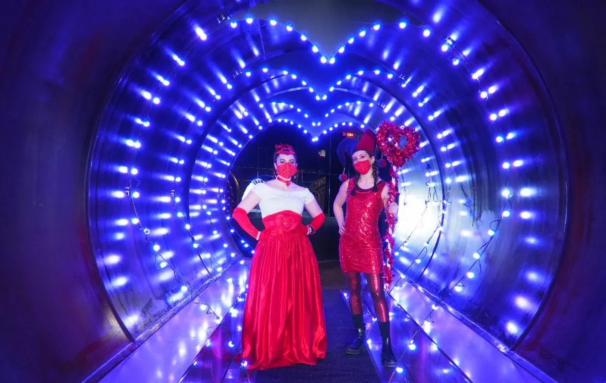 tunnel of lights with two ladies in red at the City Museum