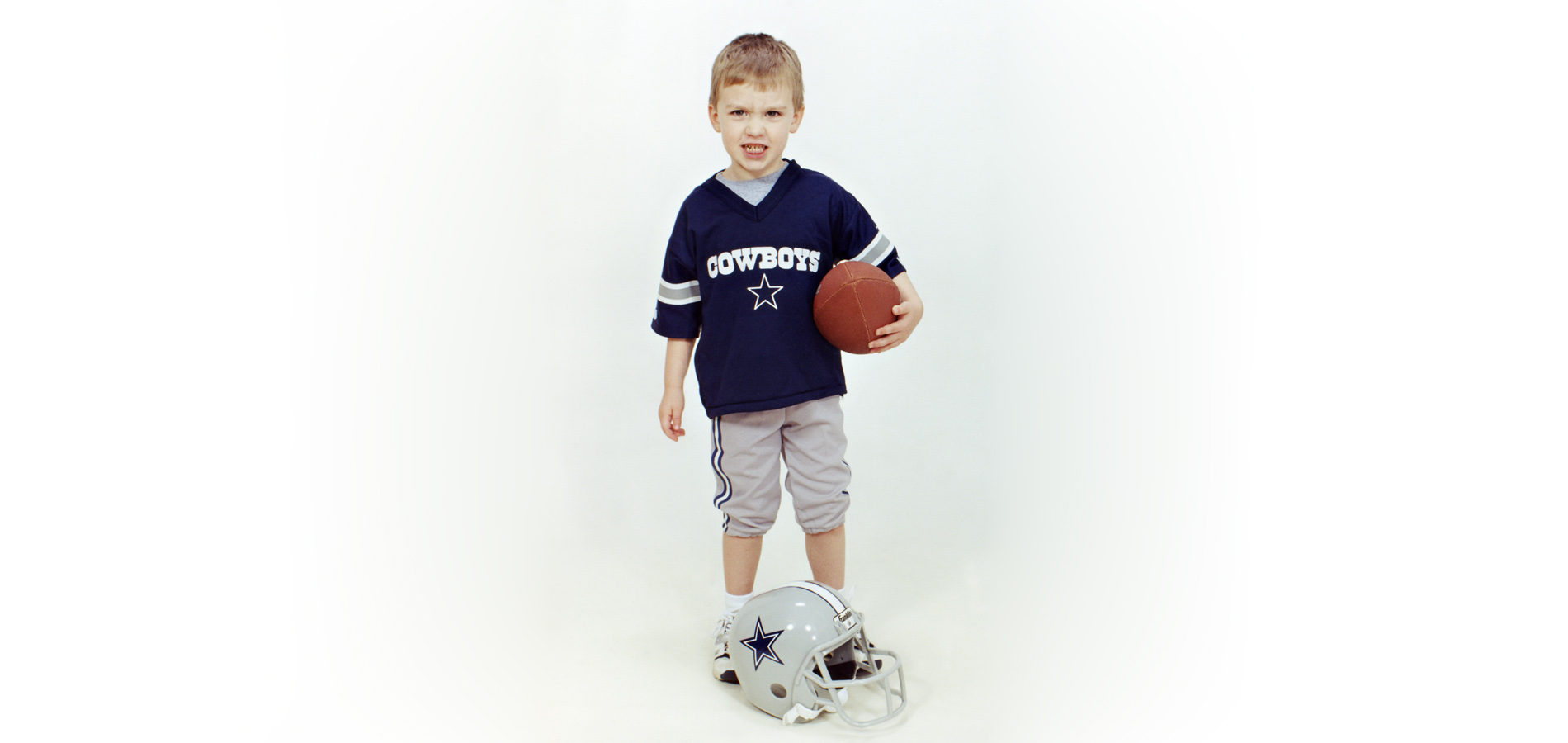 toddler in football jersey